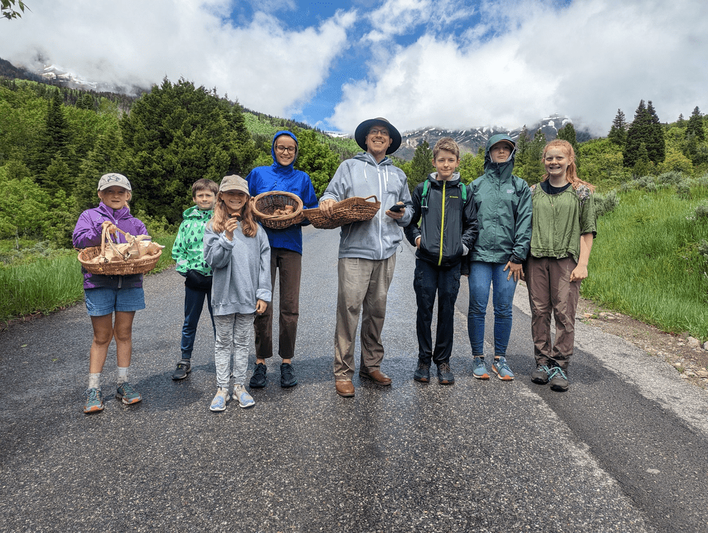 Mushroom hunters with Adam Luker on an outing with Volo, an alternative to private school near Park City.