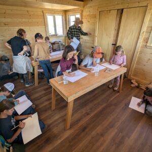 Group of Volo students in our tiny schoolhouse as part of learning in this alternative to a Private School near Park City.